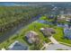 Waterfront community with lush landscape, aerial view at 6180 Knotty Pine Ct, Port Orange, FL 32127