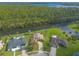 Waterfront property with multiple houses, aerial view at 6180 Knotty Pine Ct, Port Orange, FL 32127