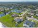 Aerial view of a house and neighborhood, showcasing the property's location and surrounding area at 6180 Knotty Pine Ct, Port Orange, FL 32127