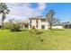Two-story home with a large backyard and grassy area at 6180 Knotty Pine Ct, Port Orange, FL 32127