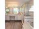 Bathroom boasts double sinks, shower, and garden tub at 6180 Knotty Pine Ct, Port Orange, FL 32127