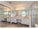 Spacious bathroom with double vanity and large shower at 6180 Knotty Pine Ct, Port Orange, FL 32127