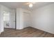 Bright bedroom with double closets and wood-look floors at 6180 Knotty Pine Ct, Port Orange, FL 32127