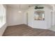Open dining area with hardwood floors and a view into the kitchen at 6180 Knotty Pine Ct, Port Orange, FL 32127