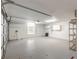 Garage with overhead door and storage shelving at 6180 Knotty Pine Ct, Port Orange, FL 32127