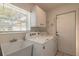 Laundry room with washer, dryer, and utility sink at 6180 Knotty Pine Ct, Port Orange, FL 32127