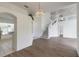 Bright living room with high ceilings, hardwood floors, and a staircase at 6180 Knotty Pine Ct, Port Orange, FL 32127