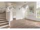 Two story living room with hardwood floors, high ceilings and loft area at 6180 Knotty Pine Ct, Port Orange, FL 32127