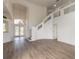 Spacious living room with high ceilings, hardwood floors, and a loft area at 6180 Knotty Pine Ct, Port Orange, FL 32127