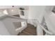 Modern staircase with wood steps and glass railings at 6180 Knotty Pine Ct, Port Orange, FL 32127