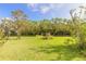 Beautiful waterfront property with lush landscaping at 6180 Knotty Pine Ct, Port Orange, FL 32127