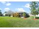 Landscaped backyard featuring a spacious screened patio at 101 Marathon Ln, Sanford, FL 32771