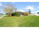 Large backyard with lush lawn and screened patio at 101 Marathon Ln, Sanford, FL 32771
