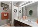 Bathroom with a double vanity, a large mirror, and a bathtub at 101 Marathon Ln, Sanford, FL 32771