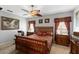 Bedroom with king-size bed and tropical decor at 101 Marathon Ln, Sanford, FL 32771