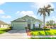 Beautiful two-story house with a two-car garage and palm tree at 101 Marathon Ln, Sanford, FL 32771