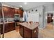 Well-equipped kitchen with an island and dark wood cabinets at 101 Marathon Ln, Sanford, FL 32771