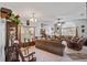 Spacious living room with ample seating and large windows at 101 Marathon Ln, Sanford, FL 32771