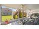Spacious screened porch with seating area and ceiling fans at 101 Marathon Ln, Sanford, FL 32771