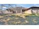 Screened patio and backyard with lush landscaping at 1185 N Old Mill Dr, Deltona, FL 32725