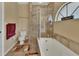 Large bathroom with a shower, bathtub, and window at 1185 N Old Mill Dr, Deltona, FL 32725