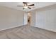 Spacious bedroom with double door closet and view into the living area at 1185 N Old Mill Dr, Deltona, FL 32725