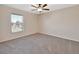 Bright bedroom with carpeted floors and ceiling fan at 1185 N Old Mill Dr, Deltona, FL 32725