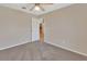 Spacious bedroom with door leading to kitchen area at 1185 N Old Mill Dr, Deltona, FL 32725