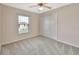 Bright bedroom with ceiling fan and window view at 1185 N Old Mill Dr, Deltona, FL 32725