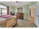 Well-lit bedroom with built-in dresser and access to hallway at 1185 N Old Mill Dr, Deltona, FL 32725