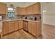 Kitchen boasts wood cabinets, tile backsplash, and stainless steel appliances at 1185 N Old Mill Dr, Deltona, FL 32725