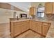 Kitchen with wood cabinets, stainless steel appliances, and tile backsplash at 1185 N Old Mill Dr, Deltona, FL 32725