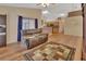 Living area with hardwood floors, a comfy recliner, and an entertainment center at 1185 N Old Mill Dr, Deltona, FL 32725
