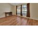 Bright living room with hardwood floors and large windows at 1185 N Old Mill Dr, Deltona, FL 32725