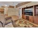 Living room with hardwood floors and built-in entertainment center at 1185 N Old Mill Dr, Deltona, FL 32725