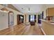 Living room with hardwood floors, recessed lighting, and a comfortable recliner at 1185 N Old Mill Dr, Deltona, FL 32725