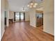 Spacious living room featuring hardwood floors and a view of the kitchen at 1185 N Old Mill Dr, Deltona, FL 32725