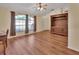 Hardwood floor living room with built-in entertainment center at 1185 N Old Mill Dr, Deltona, FL 32725