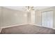 Spacious bedroom with ceiling fan, neutral walls, and carpet at 130 White Fawn Dr # 1300, Daytona Beach, FL 32114