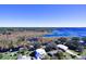 Aerial view showcasing lakefront property and surrounding neighborhood at 1518 Lakeside Dr, Deland, FL 32720