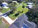 Aerial view of a house and driveway, highlighting its neighborhood setting at 1518 Lakeside Dr, Deland, FL 32720