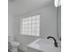 Modern bathroom with a sink and block window at 1518 Lakeside Dr, Deland, FL 32720