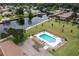 Community pool with surrounding green space at 1640 Juno Trl # 205A, Astor, FL 32102