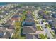 Aerial view of a beautiful community with lake access, featuring a variety of homes at 219 Lugano Way, Debary, FL 32713