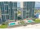 Aerial view of two beachfront condo buildings with pools at 3311 S Atlantic Ave # 304, Daytona Beach Shores, FL 32118