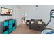 Bedroom with bunk beds, armchair, and view into another room at 3311 S Atlantic Ave # 304, Daytona Beach Shores, FL 32118