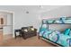 Bedroom with bunk beds, nightstand, and comfortable armchair at 3311 S Atlantic Ave # 304, Daytona Beach Shores, FL 32118