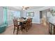 Spacious dining area with a large table, seating for eight, and hardwood floors at 3311 S Atlantic Ave # 304, Daytona Beach Shores, FL 32118