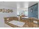 Kitchen features granite countertops, double sink, and views into living area at 3311 S Atlantic Ave # 304, Daytona Beach Shores, FL 32118