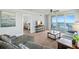 Living room with ocean view, sectional sofa and access to bedroom at 3311 S Atlantic Ave # 304, Daytona Beach Shores, FL 32118